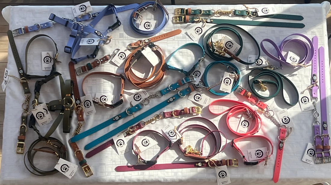 Various colorful dog collars arranged on a table.